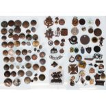 A collection of enamelled club badges and military related cap badges from a metal detector's