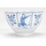 A 19th Century Chinese blue and white tea bowl raised on a round foot of a reeded form having hand