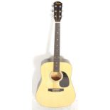 A Fender made Squier series acoustic guitar. Six string, model SA-105. In black with natural wood