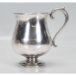 A Birmingham hallmarked Edwardian 1912 silver tankard with scroll handles by T Wilkinson & Sons.