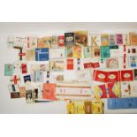 A collection of vintage 20th Century cigarette packets and paper cigarette packet labels to