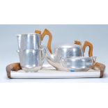 A mid century Piquot ware tea service comprising coffee / teapots tray, bowl and creamer etc as seen