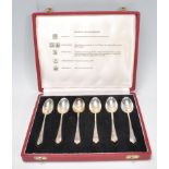 A 20th Century set of six Travis, Wilson & Co Ltd tea spoons set within a red leatherette box.