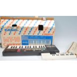 A vintage retro 20th Century Casio Casiotone MT-18 electronic keyboard in original box together with