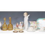 A collection of ceramics to include a Lladro winged cherub / putti together with a Mary Gregory type