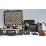 A group of cameras and camera related items to include a leather cased Rolleiflex Franke &