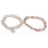 Two stamped 925 silver bracelets to include a sweetheart design bracelet with a heart charm together