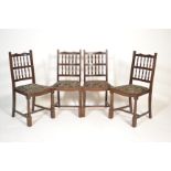 An Ercol beech and elm refectory dining table and chairs suite. The rectangular dining table