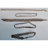 A selection of silver bracelets to include a flat link chain bracelet, rope twist bracelet, with