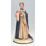 A 20th Century Capodimonte figure of Queen Elizabeth II signed B Merli raised on an oval base.