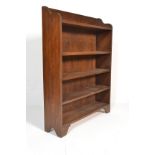 A good quality early 20th century Arts & Crafts solid oak open window large bookcase. Shaped sides