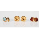 A group of three 9ct gold stud earrings to include a pair of knot design earrings, a pair set with