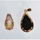 A 9ct gold hallmarked Rutile Quartz pedant together with a 14ct gold Ammolite teardrop shaped