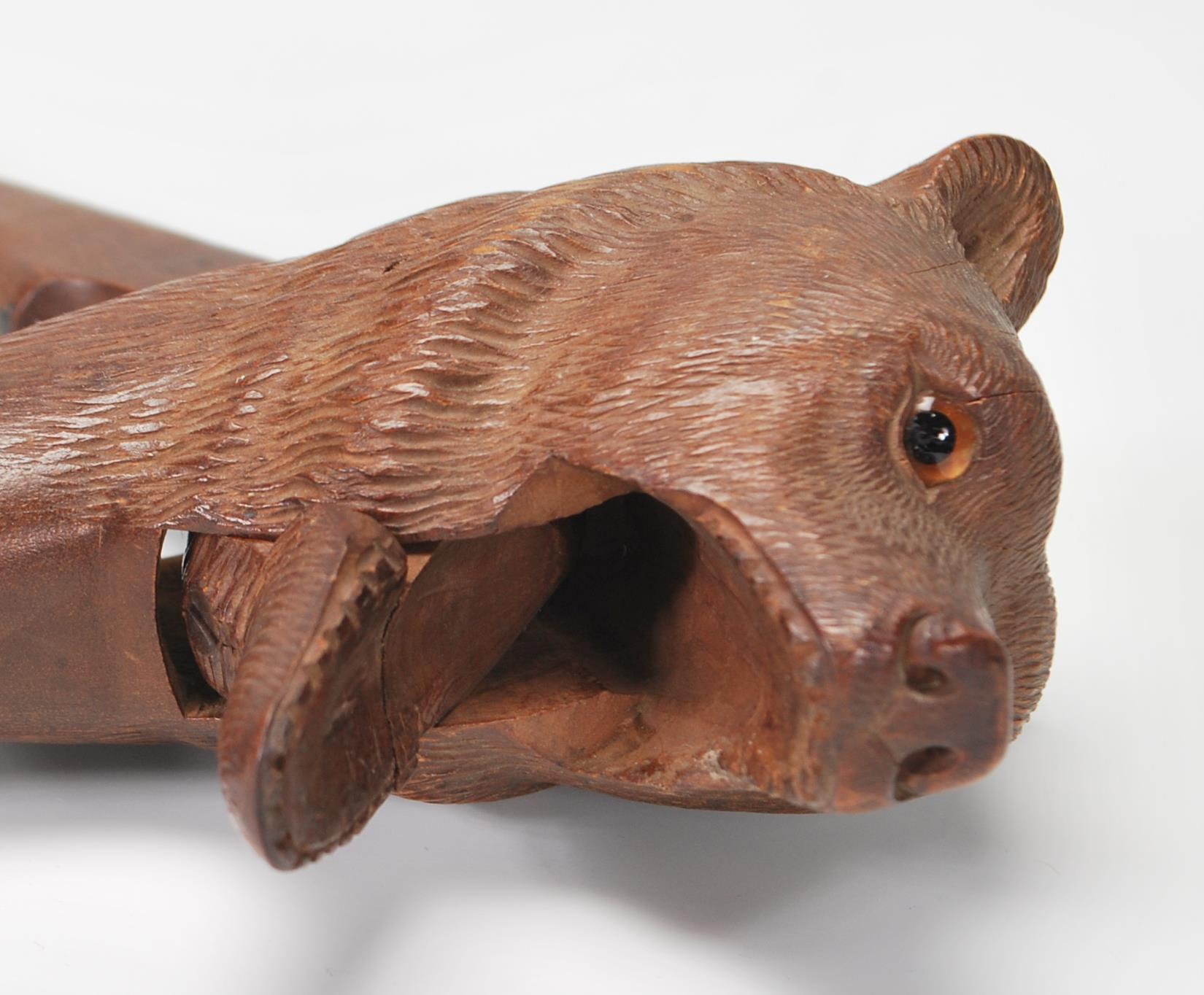 An early 20th Century black forest wooden nut cracker in the form of a bear having carved - Image 3 of 6