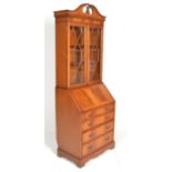 A contemporary Georgian Revival walnut bureau bookcase, glazed doors to the top over full front