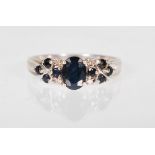A HALLMARKED 9CT GOLD SAPPHIRE AND DIAMOND RING
