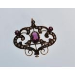 A late 19th century 9ct gold Victorian Art Nouveau pendant brooch of symmetrical scrolled form set