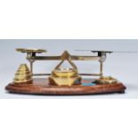 A good 19th century large Victorian oak and brass set of postal scales. The oak base complete with
