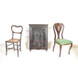 An Edwardian mahogany Art Nouveau bedroom chair together with an elm and cane worked bedroom chair