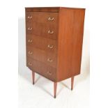 A retro vintage mid 20th Century teak wood chest of five graduating drawers raised on tapering