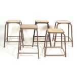 A set of 4 mid century retro painted tubular metal lab - laboratory stools. Each with painted