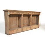 An early 20th Century oak top shelf unit / open window bookcase cabinet having  three sections