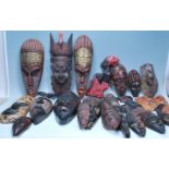 A collection of forty+ 20th Century tribal African masks of varying sizes and styles. Many being