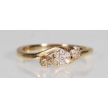 A hallmarked 9ct gold and diamond triple cluster ring. The ring being set with a triple cluster of