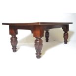 A large antique style jacobean revival refectory dining table. Solid mahogany and hardwood table