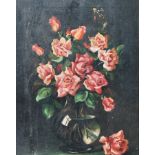 An early 20th Century oil on canvas still life painting depicting a bouquet of pink roses in a glass