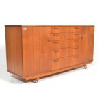 A retro 20th Century teak wood believed Danish sideboard  having a central bank of 5 drawers with