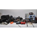 A collection of vintage cameras and accessories, various makes of cameras to include 35mm, lenses,