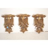 A matching set of three 20th Century Georgian style decorative gilt resin eagle  birds of prey