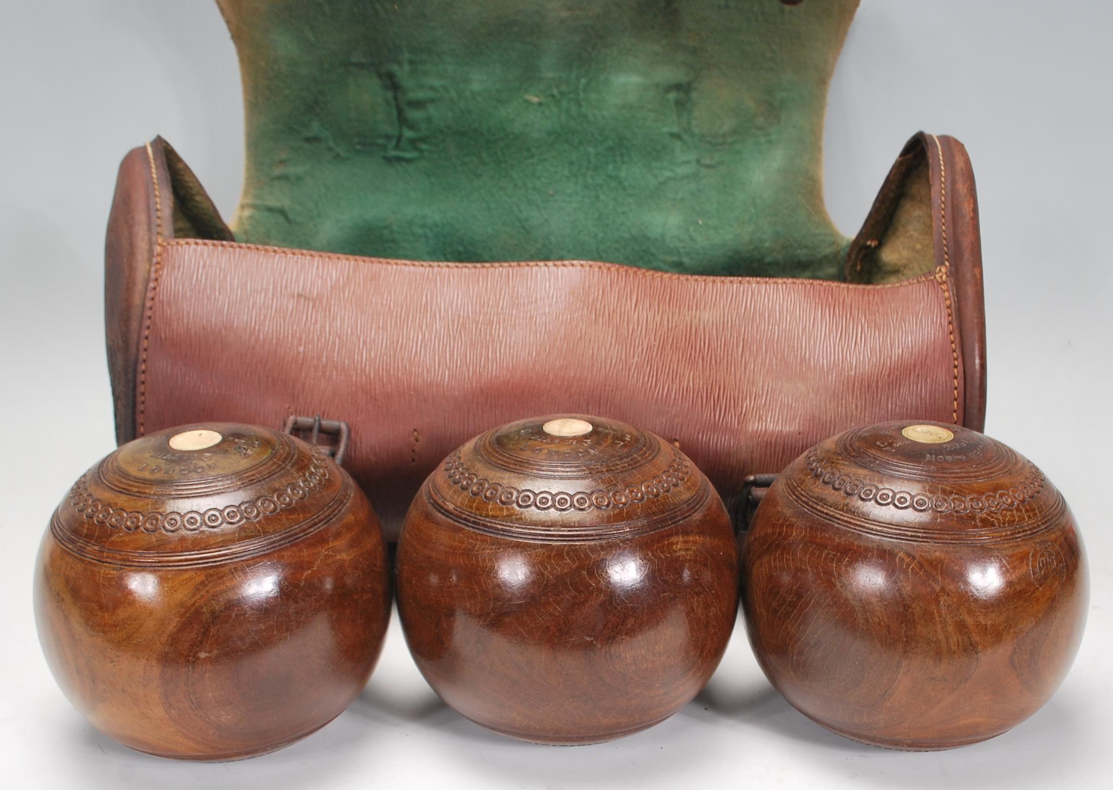 Crown Green Bowls - A set of three early 20th century vintage lignum vitae bowling bowls, in - Image 2 of 6