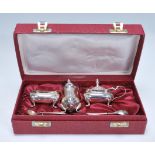 A 20th Century Barker Brothers silver cruet set consisting mustard pot, pepperette, and table sale