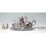 A collection of silver plated items to include coffee pot, salver tray, condiments, table salts with