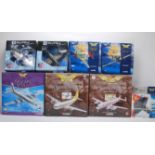 A group of eight, mostly Corgi model plane kits to include a NewRay Sky Pilot P-40 and P-51. The