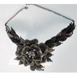 A Butler and Wilson fashion jewellery collar choker necklace in the form of a rose set with black