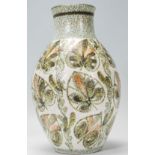 An early 20th Century Bourne Denby pottery vase by Glyn Colledge, decorated with stylised leaves,