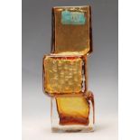 A vintage 20th Century amber glass drunken bricklayer vase in the manner of Geoffrey Baxter for