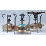 A collection of 3 vintage Primus stoves in brass to include a Monitor, Optimus and a Pri-mus. All