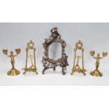 A matching pair of contemporary Rococo style brass table easels having acanthus and scroll