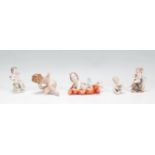 A group of five early 20th Century Capodimonte Naples ceramic figurines in the form of babies /