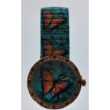 A ladies wristwatch having a round face decorated with butterflies and coloured stones to the