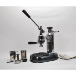 A contemporary stainless steel polished modern Pivano coffee machine complete with the accessories