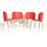 A set of four retro American diner style wedge dining chairs, red vinyl seat covers and backrests