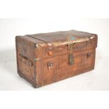 A 19th Century brown leather carriage travel trunk having a brass cartouche panel to the lid