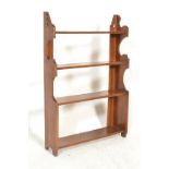 A 19th century Victorian Arts & Crafts solid mahogany set of shelves. The uprights sides of shaped