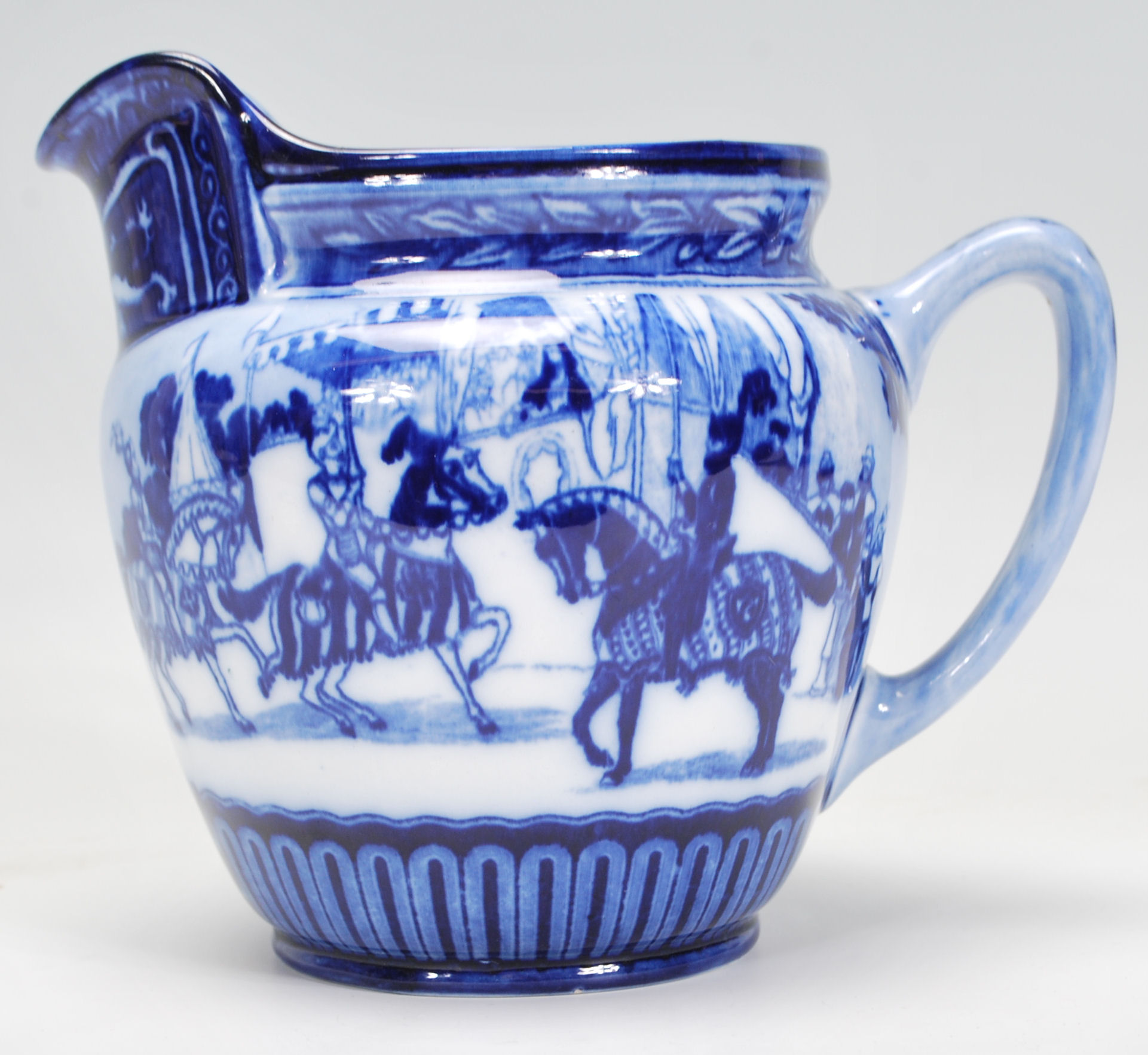 A Royal Doulton Eglinton Tournament jug having transfer printed blue and white decoration