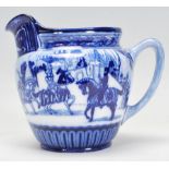 A Royal Doulton Eglinton Tournament jug having transfer printed blue and white decoration